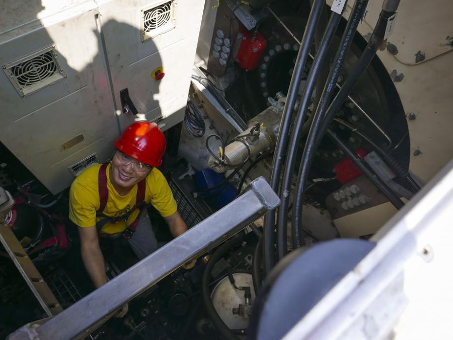 Jeremy Xu inside a wind turbine nacelle.